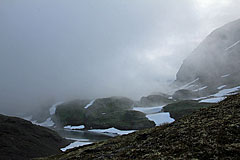 Wolken ziehen über die Lureggane-Ebene